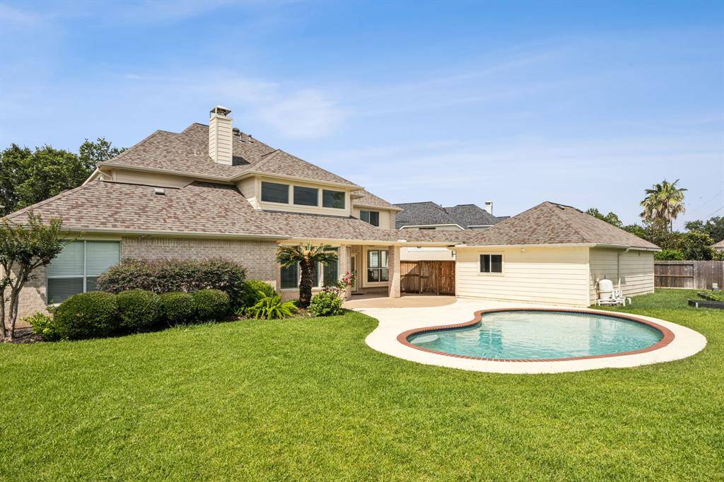 Step outside to a massive backyard oasis, beautifully landscaped and lush greenery that create a serene and private retreat.