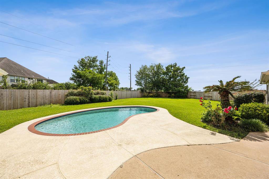 The sparkling pool serves as the centerpiece, inviting you to relax, entertain, and enjoy endless outdoor living. Whether hosting summer gatherings or unwinding after a long day, this expansive outdoor space offers the perfect blend of luxury and tranquility.