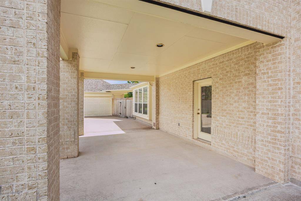 The spacious carport provides convenient and covered parking, offering easy access to the home while protecting your vehicles from the elements. Its practical design combines functionality with effortless everyday use, making arrivals and departures smooth and comfortable.