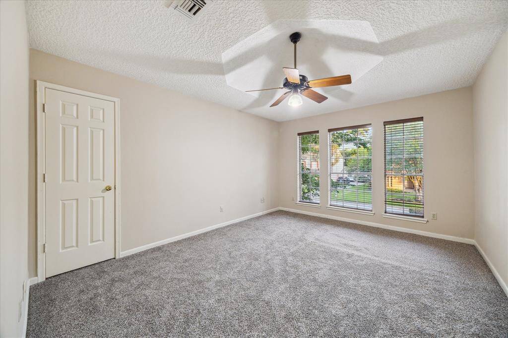 Third spacious upstairs bedroom with new carpet.