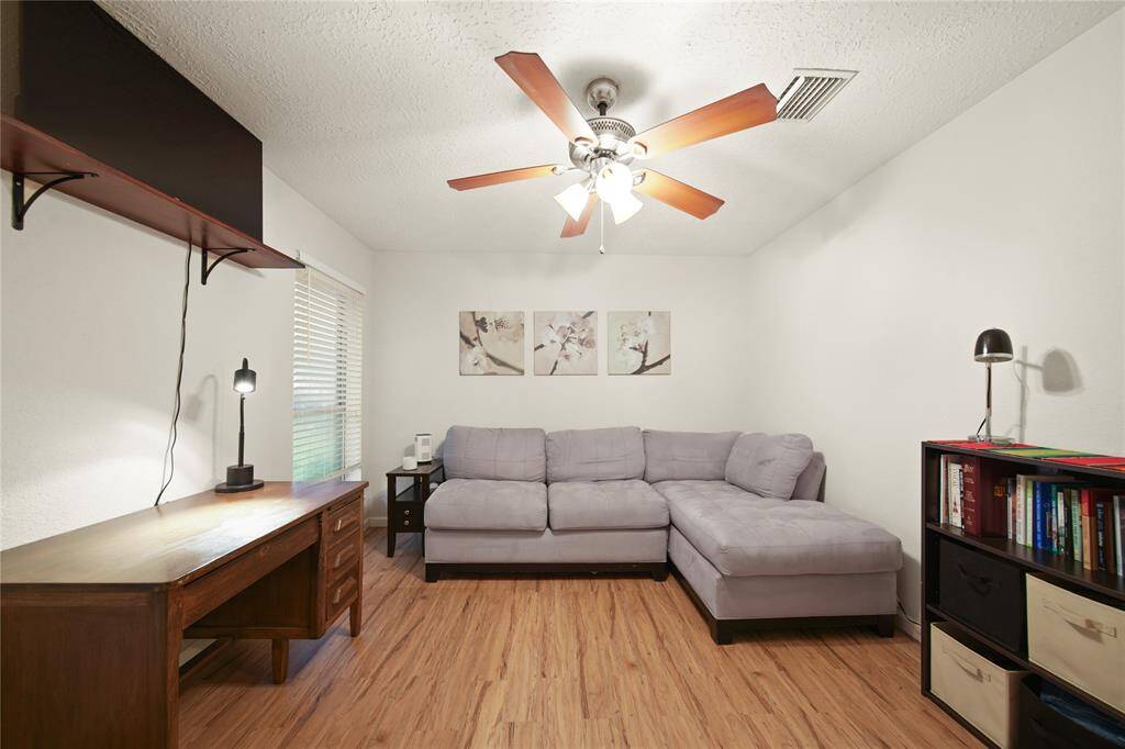 This secondary bedroom is currently set up as a study/office, offering a perfect retreat for productivity. However, its adaptable layout allows you to effortlessly convert it into whatever space you desire, whether it be a cozy guest room, a creative studio, or a personal sanctuary. Embrace the opportunity to make this room uniquely yours!