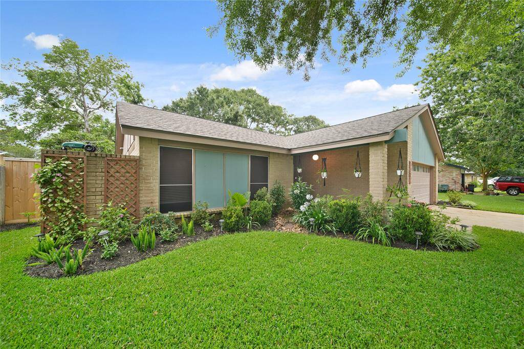 A patio area with outdoor seating offers a perfect spot for relaxation or entertaining, all surrounded by a privacy fence.
