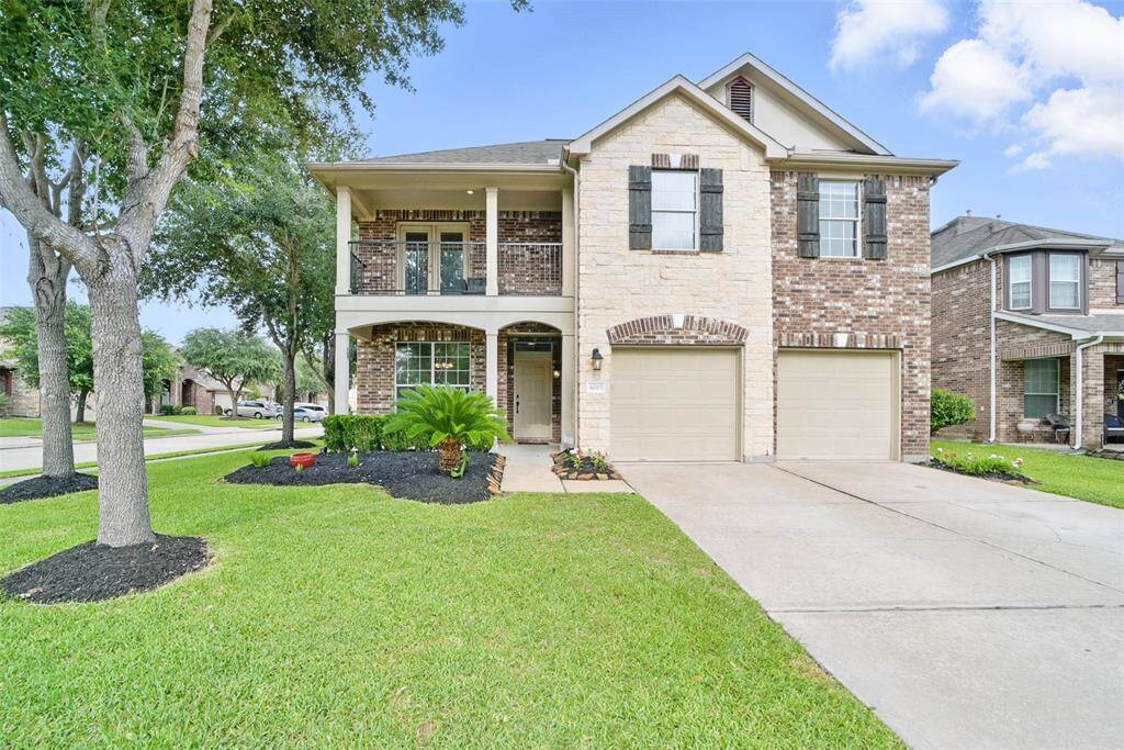 Beautiful 4-bedroom, 2.5-bath home nestled on a corner cul-de-sac lot with charming brick and stone elevation.