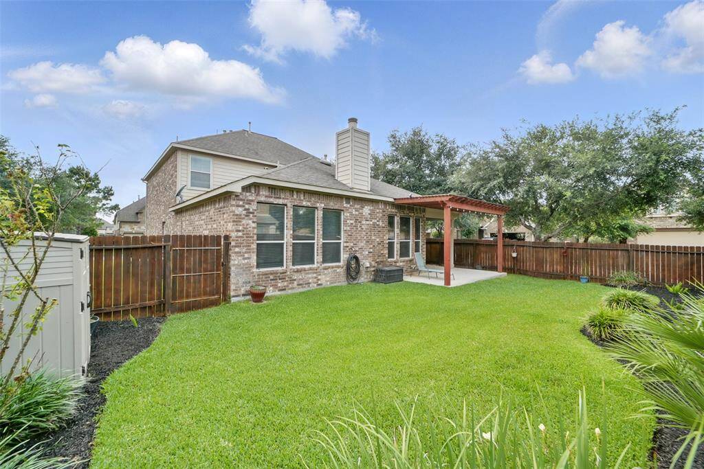 Beautifully landscaped backyard.