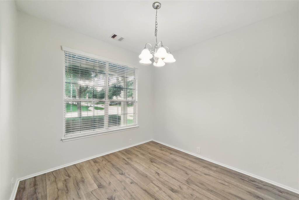 Formal dining room is located off the entry and features recent laminate flooring.