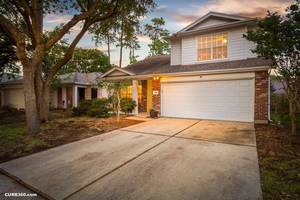 Charming two-story home with a spacious garage and inviting curb appeal. Nestled among mature trees, this residence offers a serene setting with modern comforts. Perfect for family living or entertaining, it's a must-see!