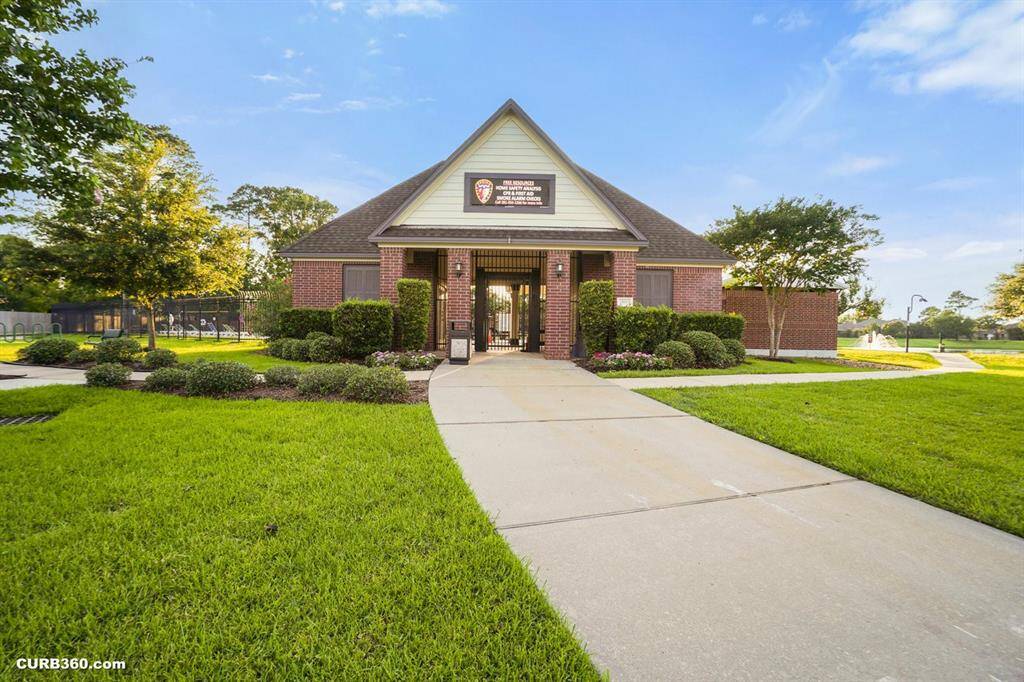 Charming community center surrounded by lush greenery, offering a welcoming space for gatherings and activities. Ideal for enhancing your neighborhood experience.