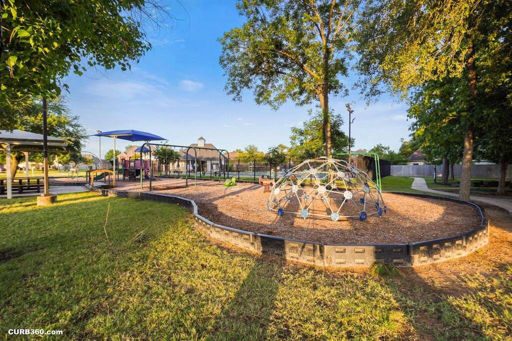Nestled in a serene neighborhood, this inviting playground offers a perfect retreat for families. Surrounded by lush trees, it features engaging play structures and a shaded picnic area, ideal for creating cherished memories.