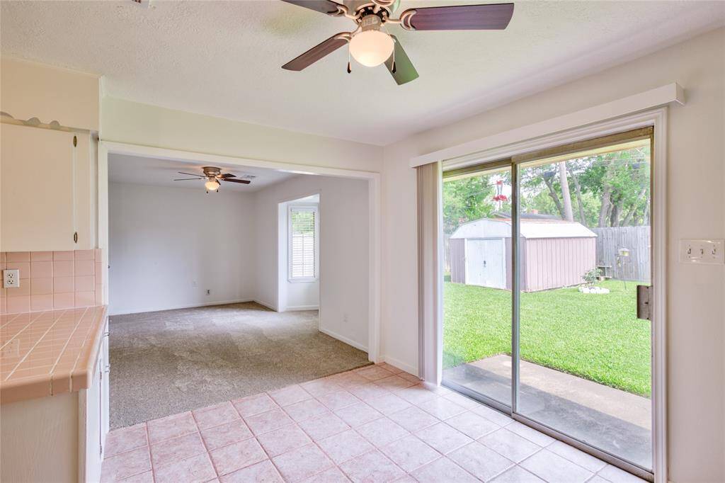 Enjoy abundant natural light and easy backyard access through the elegant sliding door.