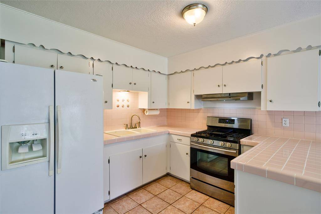 Experience the airy elegance of an open-concept kitchen seamlessly flowing into the living area.