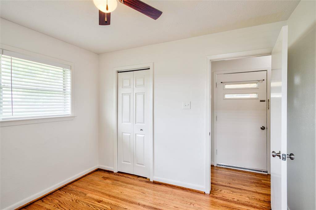 This room, located just off the entryway, offers stunning neighborhood views through its large window.