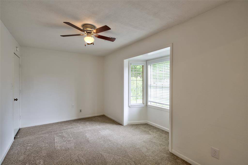 Ideal for a cozy den or productive office, this versatile space features ample natural light and a calming atmosphere.