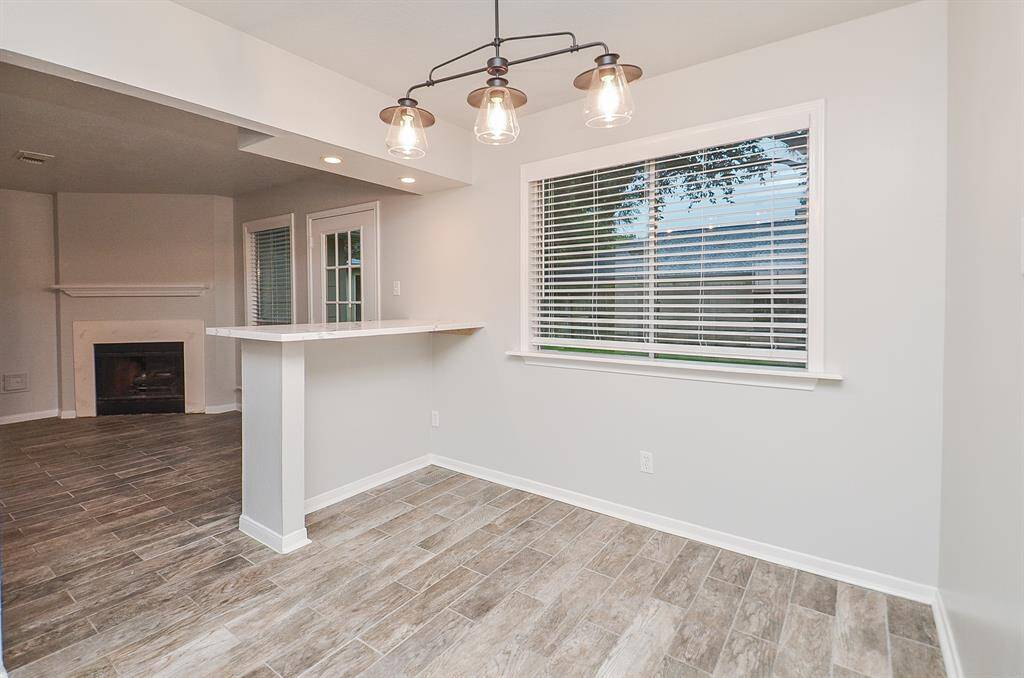 Another view of the breakfast bar and picture window