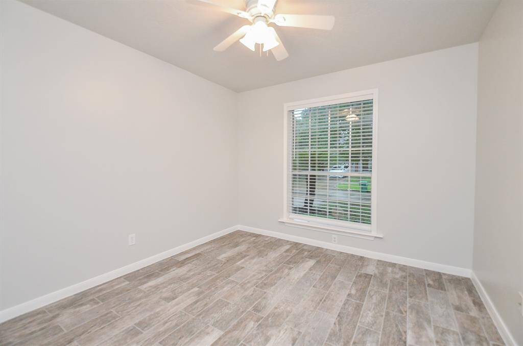 Bedroom number four with a front facing picture window.