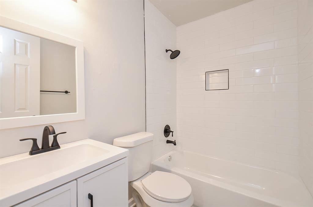 Secondary bathroom echos the primary in color and design.