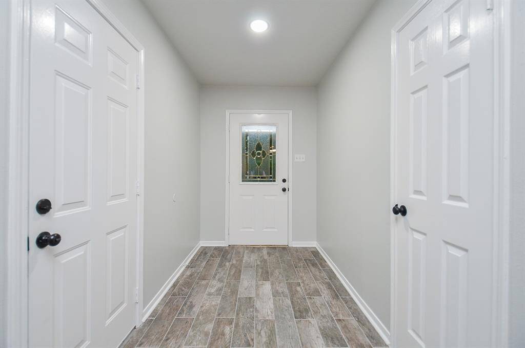 As soon as you enter the wide, front entryway you are greeted with a warm, neutral color palette.