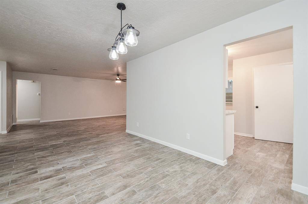 Another view of the dining area opening into the family room, as well as the flow through to the kitchen.