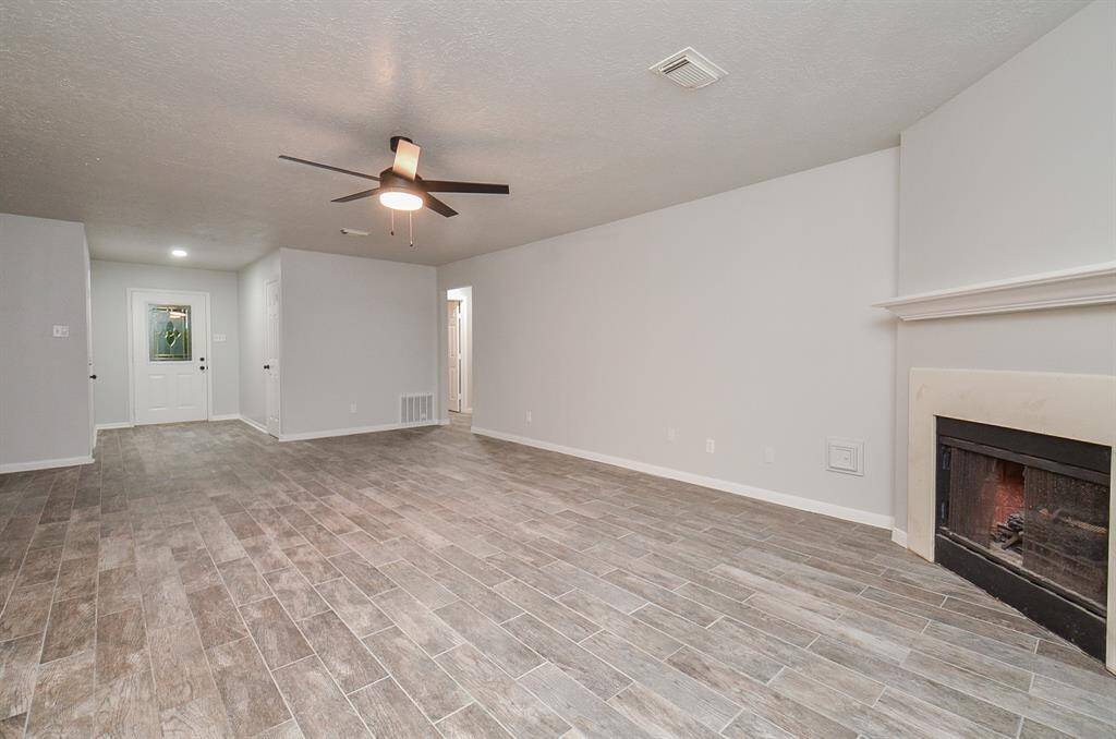 Looking back towards the front entry from the backdoor. This openess allows for natural sunlight in all the common areas of the home.