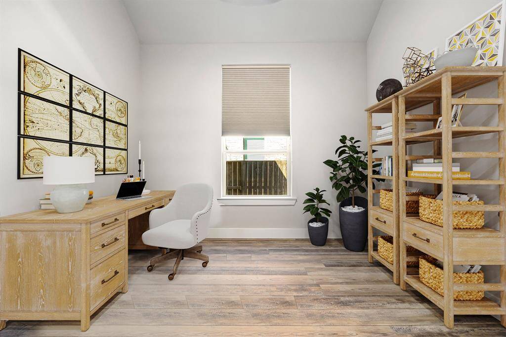 Nestled away quietly in the front of the home is the handsome and grand home office. Featuring high ceilings, neutral paint, vinyl plank flooring, and large window with privacy blinds.