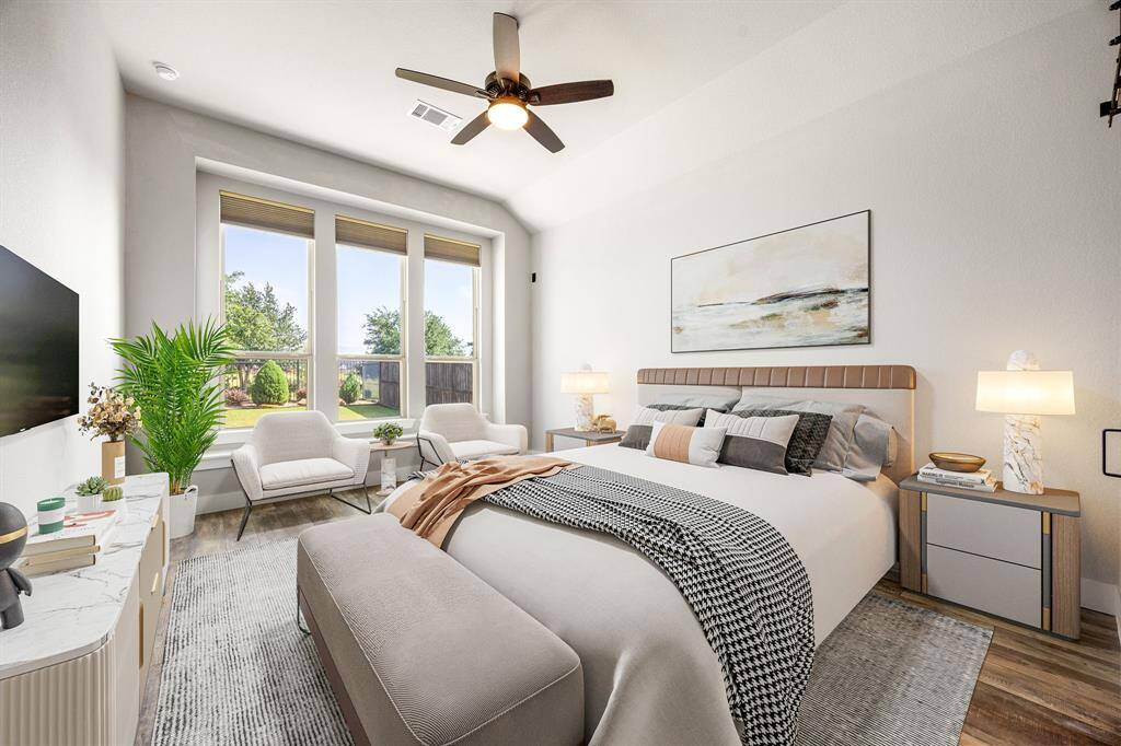 What a wonderful place to come home to, this stunning primary suite greets you with gorgeous vinyl plank floors, custom paint, raised ceilings, ceiling fan with lighting, lovely niche windows allowing in natural light brightening up this spacious primary bedroom, with extra space for a seating area.