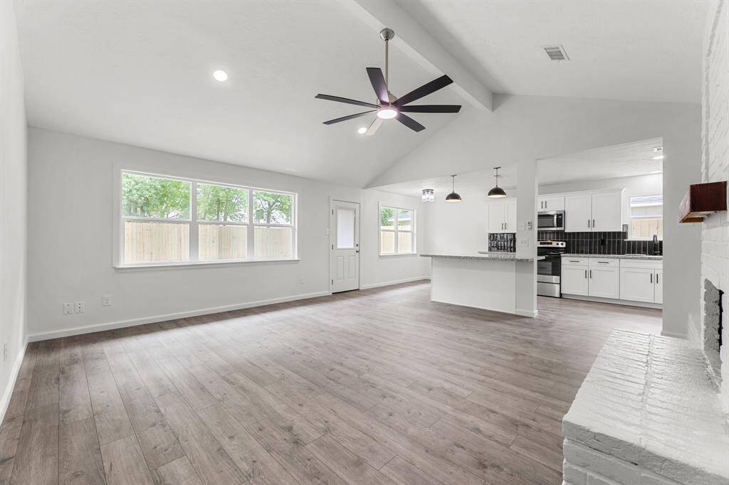Stunning Livingroom open to the kitchen.  Granite countertops and large island