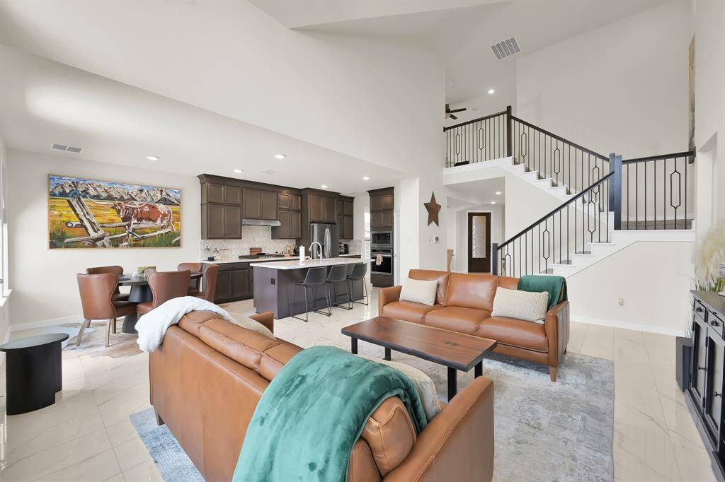 Spacious open-concept living and kitchen area with room for gathering or entertaining.