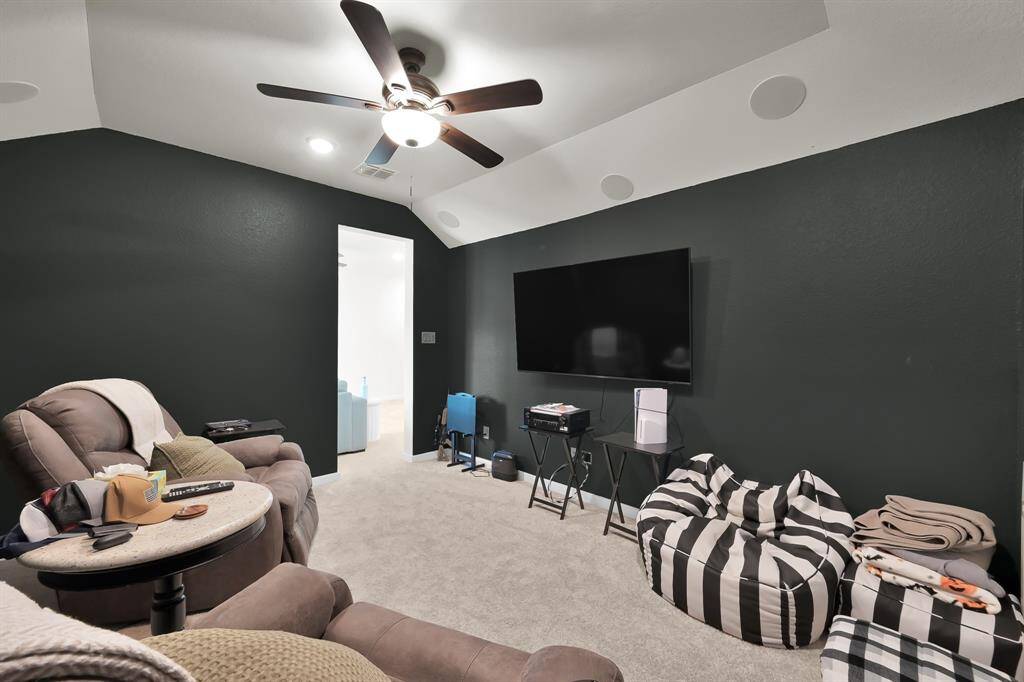 Pre-wired media room perfect for movie night relaxation!