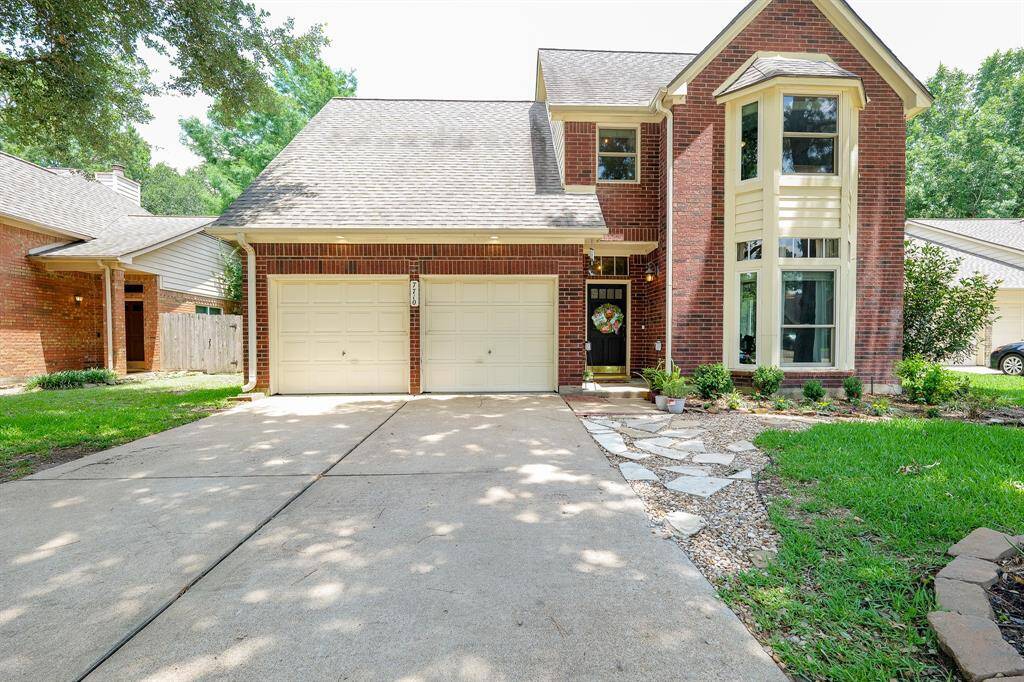 Welcome home! Beautiful bay windows welcome you.