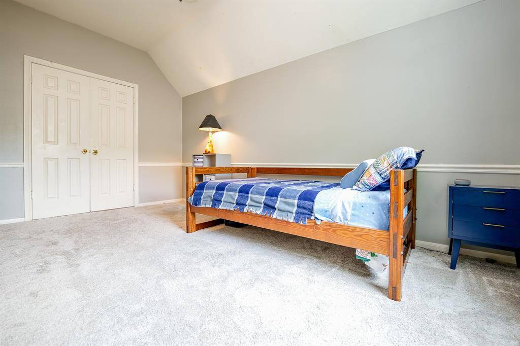 Features French doors and vaulted ceilings—ideal as a bedroom or gameroom.