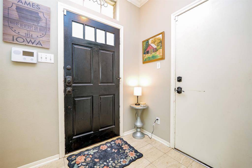 Step through a stunning front door into a warm, welcoming foyer.