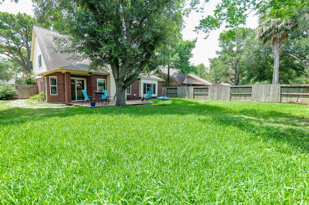 Enjoy endless possibilities in a large, lush backyard.