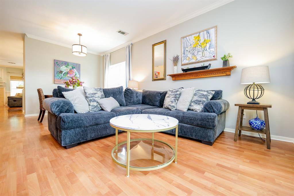 Welcome guests into the living area that features a bay window.