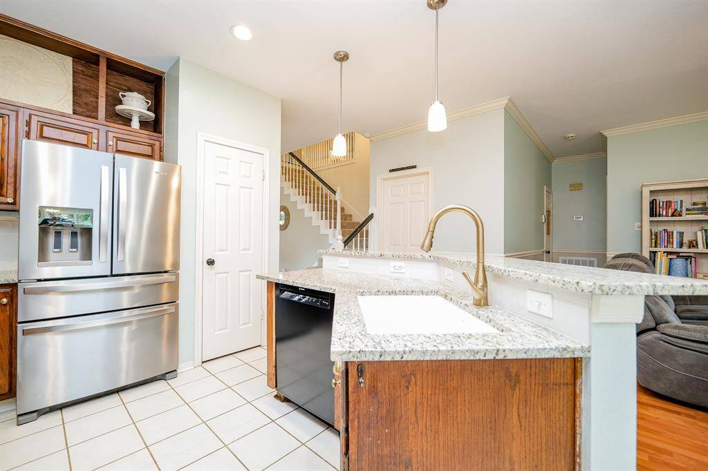 Updated with durable granite countertops and modern appeal.