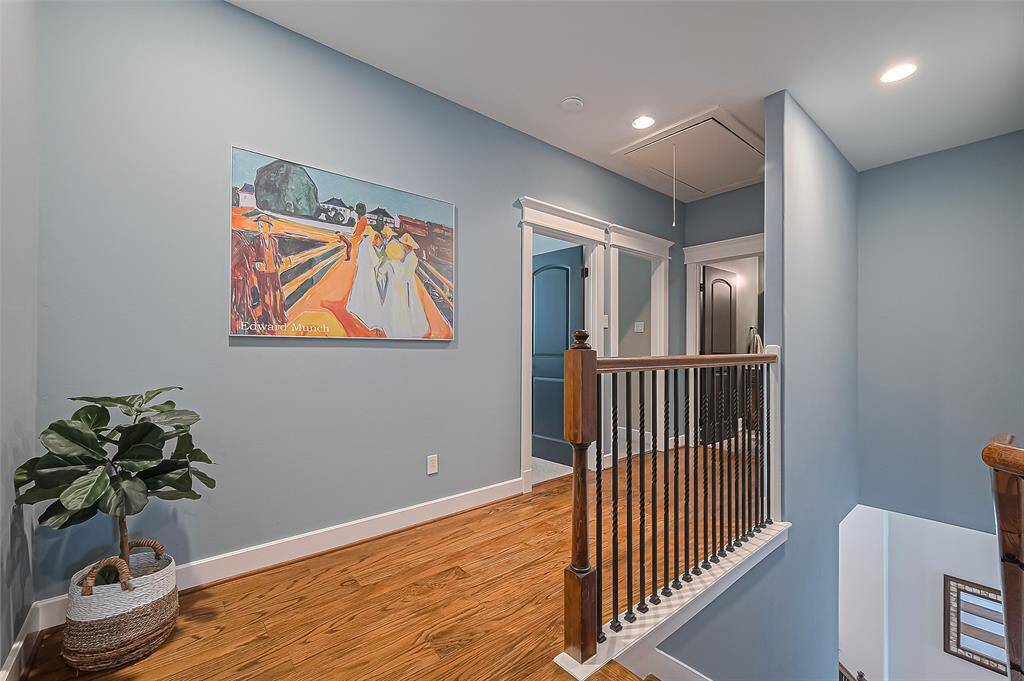 Hallway upstairs with a closet with the washer and dryer