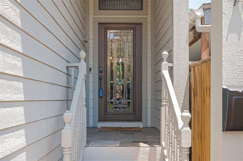 Walk up entry with a beautiful front door