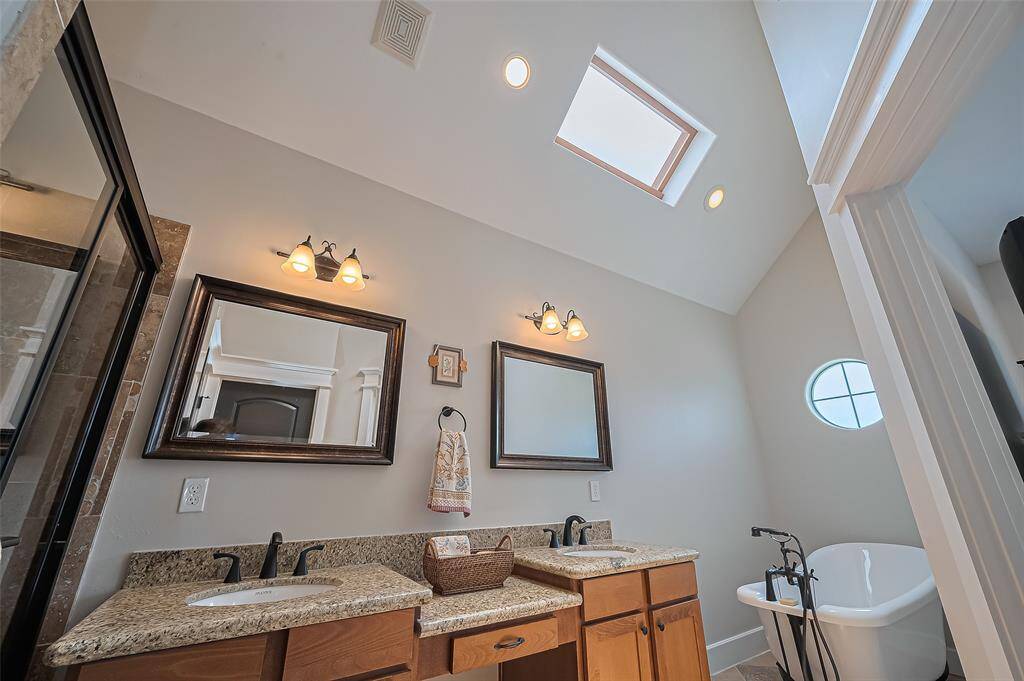 Primary bathroom with skylight