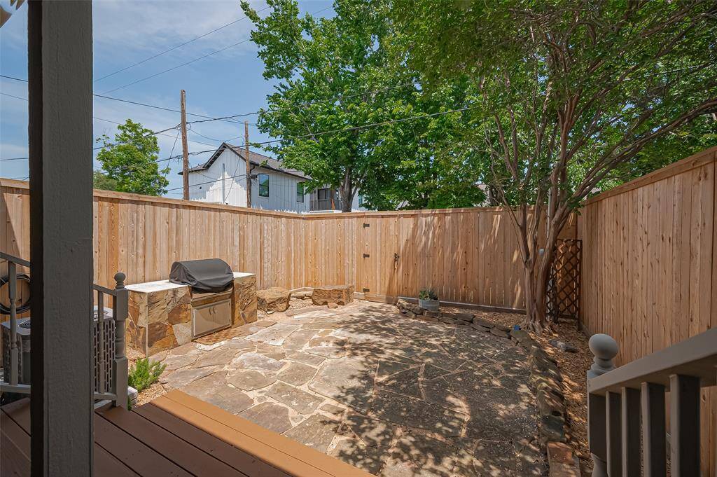 The large back yard is currently tiled, but could be a multitude of different ideas