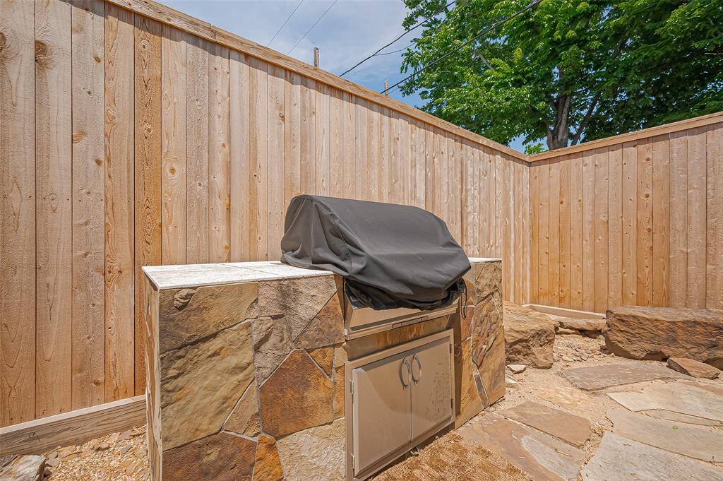 Built in grill surrounded by stone