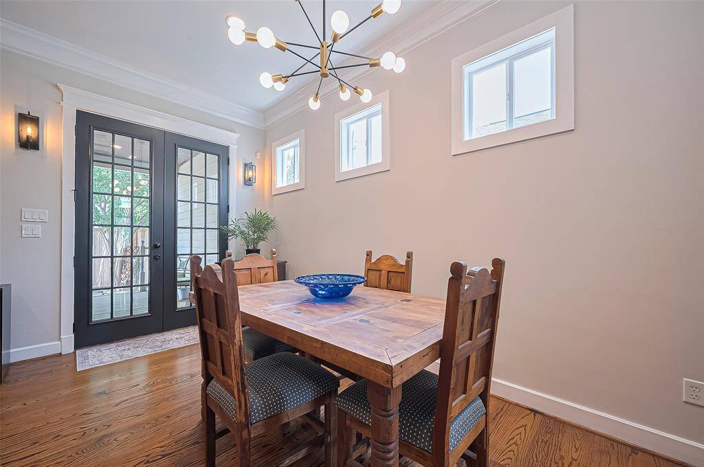 Dining area leads to the outdoor space through double doors