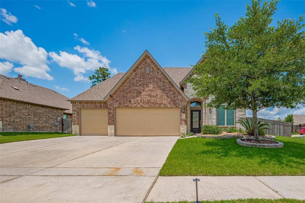 Great curb appeal with a wide driveway, three-car garage, and a spacious corner lot that offers extra room to enjoy.