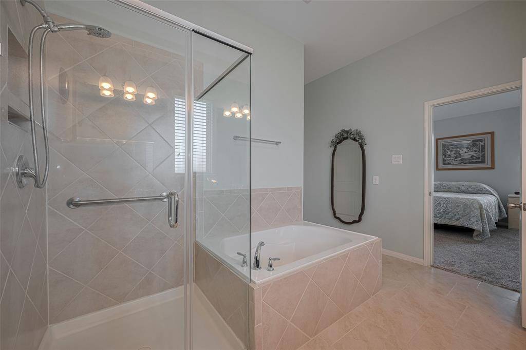 The smooth transition from bedroom to bath reflects a layout designed for ease, comfort, and everyday luxury.