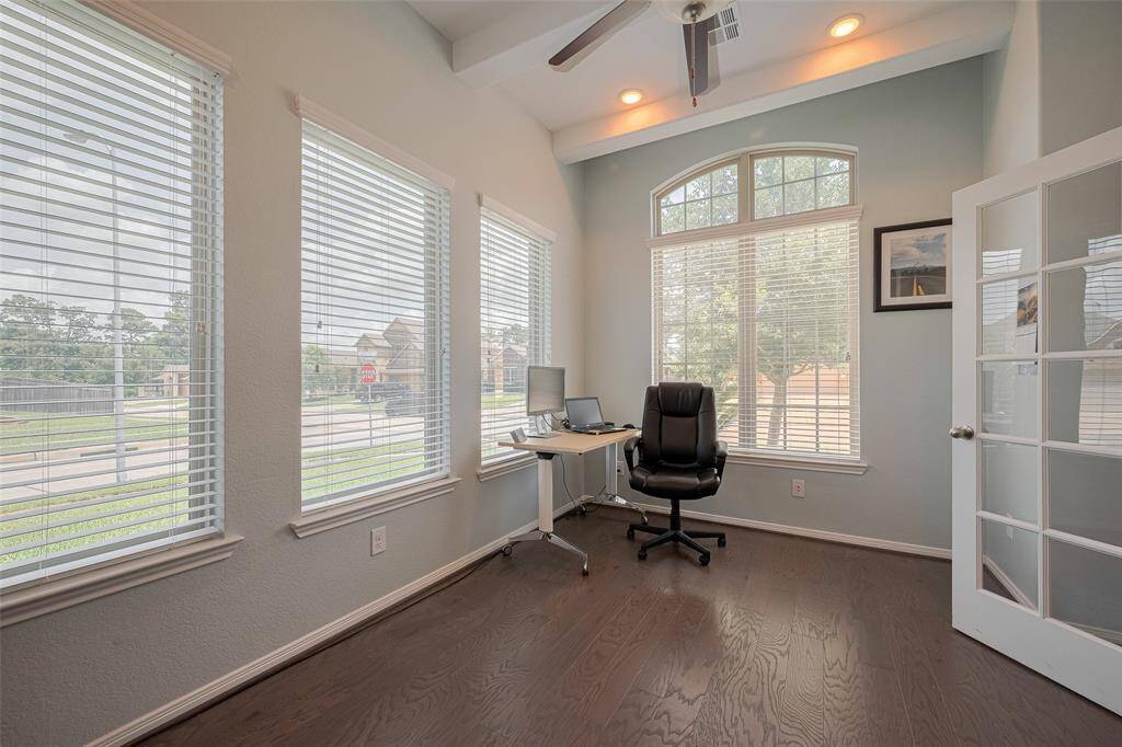 With soaring ceilings and a wall of windows, this flexible study is bathed in natural light—perfect for working from home or quiet reading time.