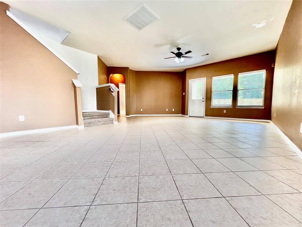 Passage to dining room with a Dry Bar and a walk-in Pantry