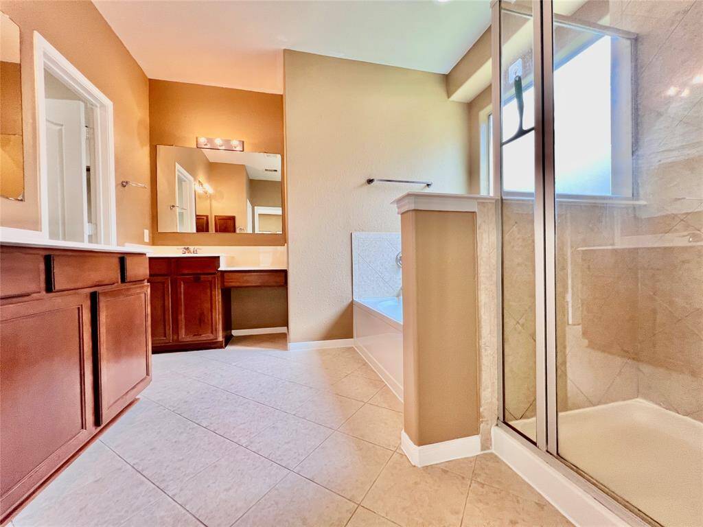 Primary Bedroom Suite with Double Sinks, Separate Shower, Soaking Tub, and  a good size Walk-in Close