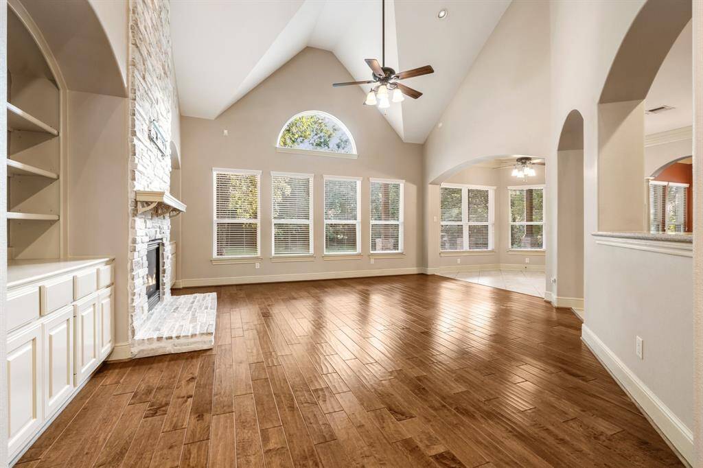Looking at Family room, notice the all of windows and gleeming wood floors
