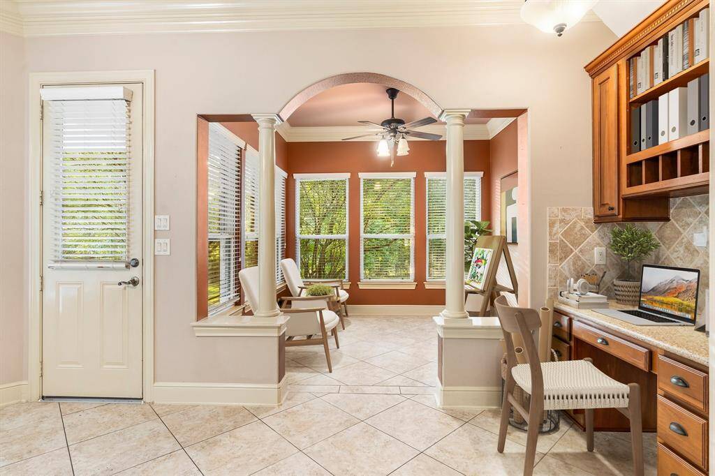 Convenient desk area and peek of Flex room with private bath and entrance to the garage. Virtually Staged