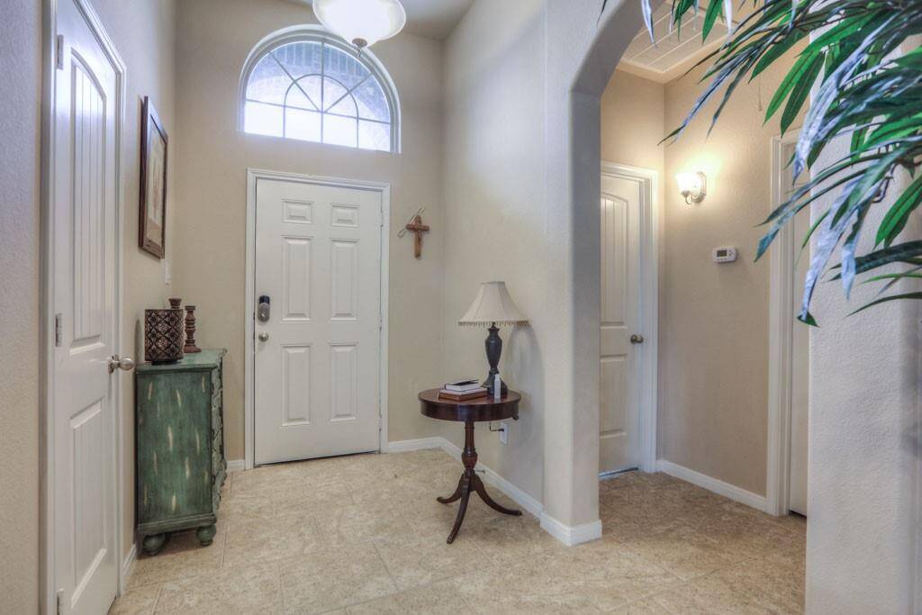 Looking back to the front door, the arch on the right leads to the 2 secondary bedrooms and hall bath.