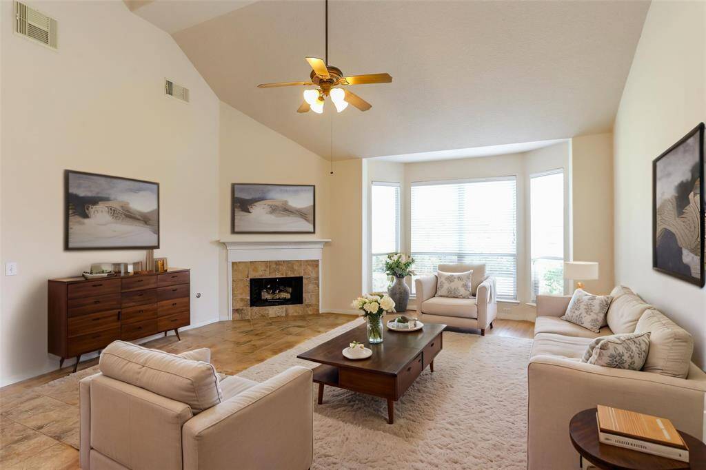 THE FAMILY ROOM LIGHT ANDBRIGHT WITH HIGH CEILINGSAND WALL SIZED WINDOWS. **This room has been virtually staged.