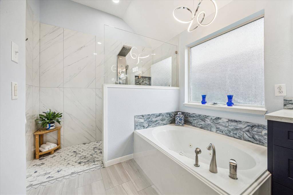 You will love this walk in shower with an amazing water fall shower system with lights and a bench.  It is a relaxing experience.