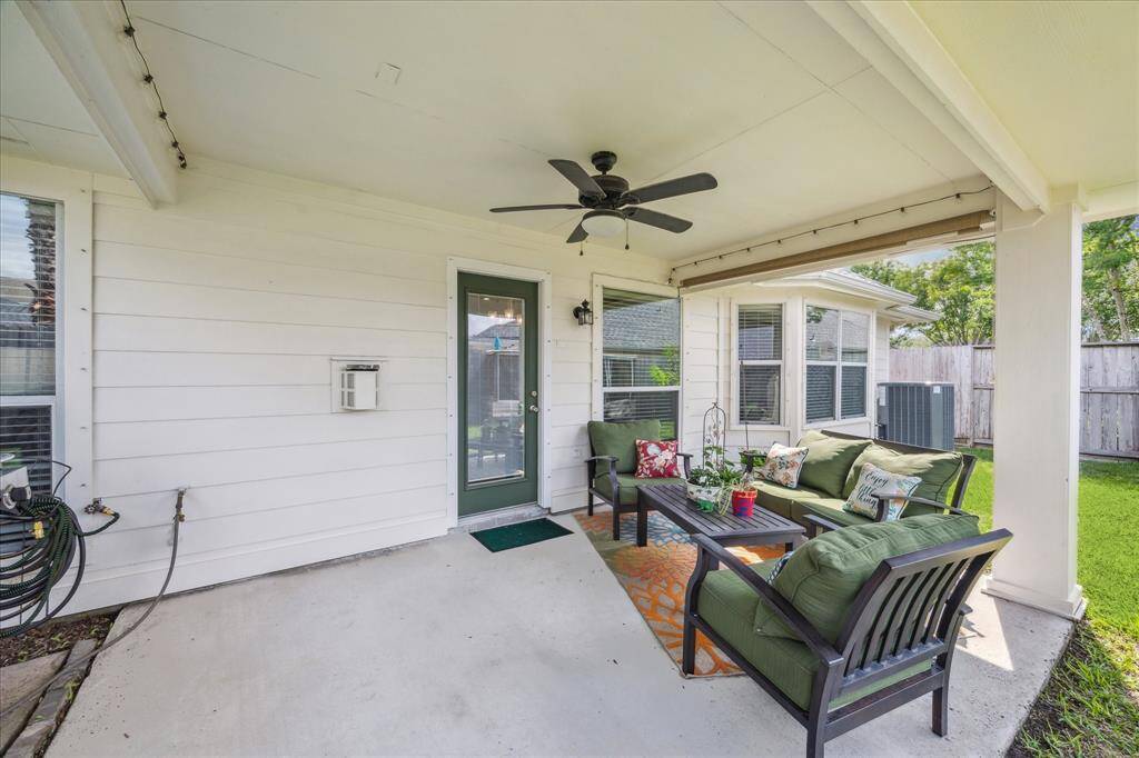 This photo showcases a cozy covered patio. Perfect for relaxing and entertaining.